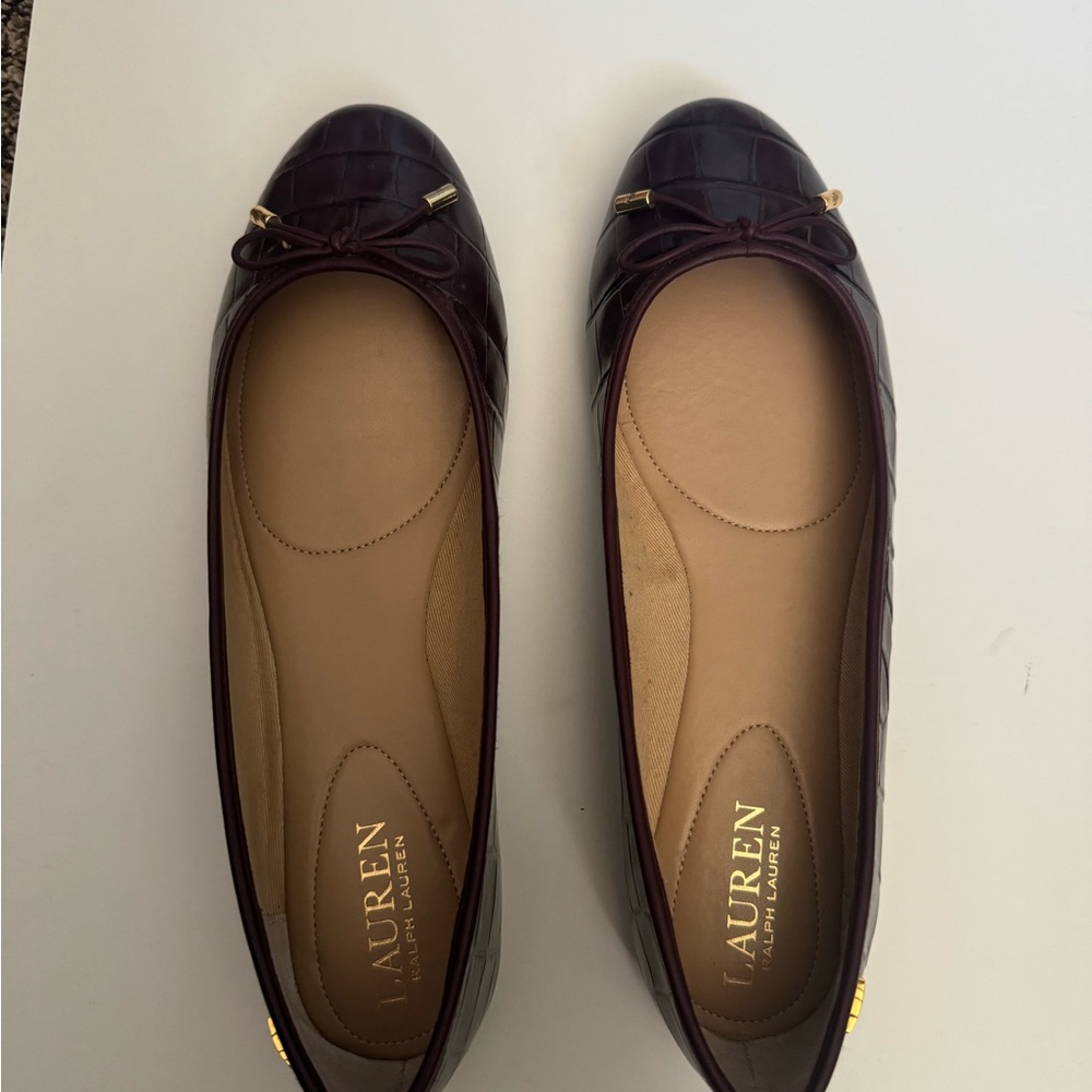 Tied in a sweet bow with signature detailing, the Jayna flats by Lauren Ralph
